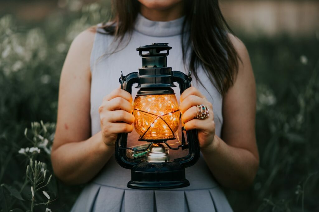 Women holding a light lantern